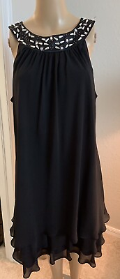 Women’s black cocktail dress with ruffled bottom Size 12 $32.00