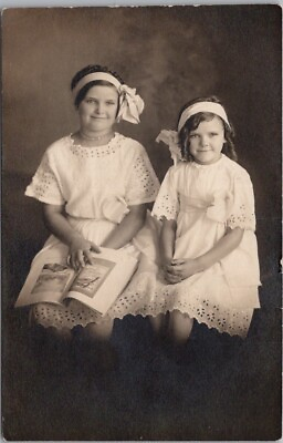 #ad c1910s RPPC Real Photo Postcard 2 Girls in Matching White Dresses Hair Bows $5.62