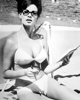 Raquel Welch wears spectacles 1960#x27;s pose in bikini on beach 16x20 poster $24.99