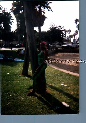 #ad FOUND COLOR PHOTO I3080 PRETTY BLACK WOMAN POISED BY TREE $3.98